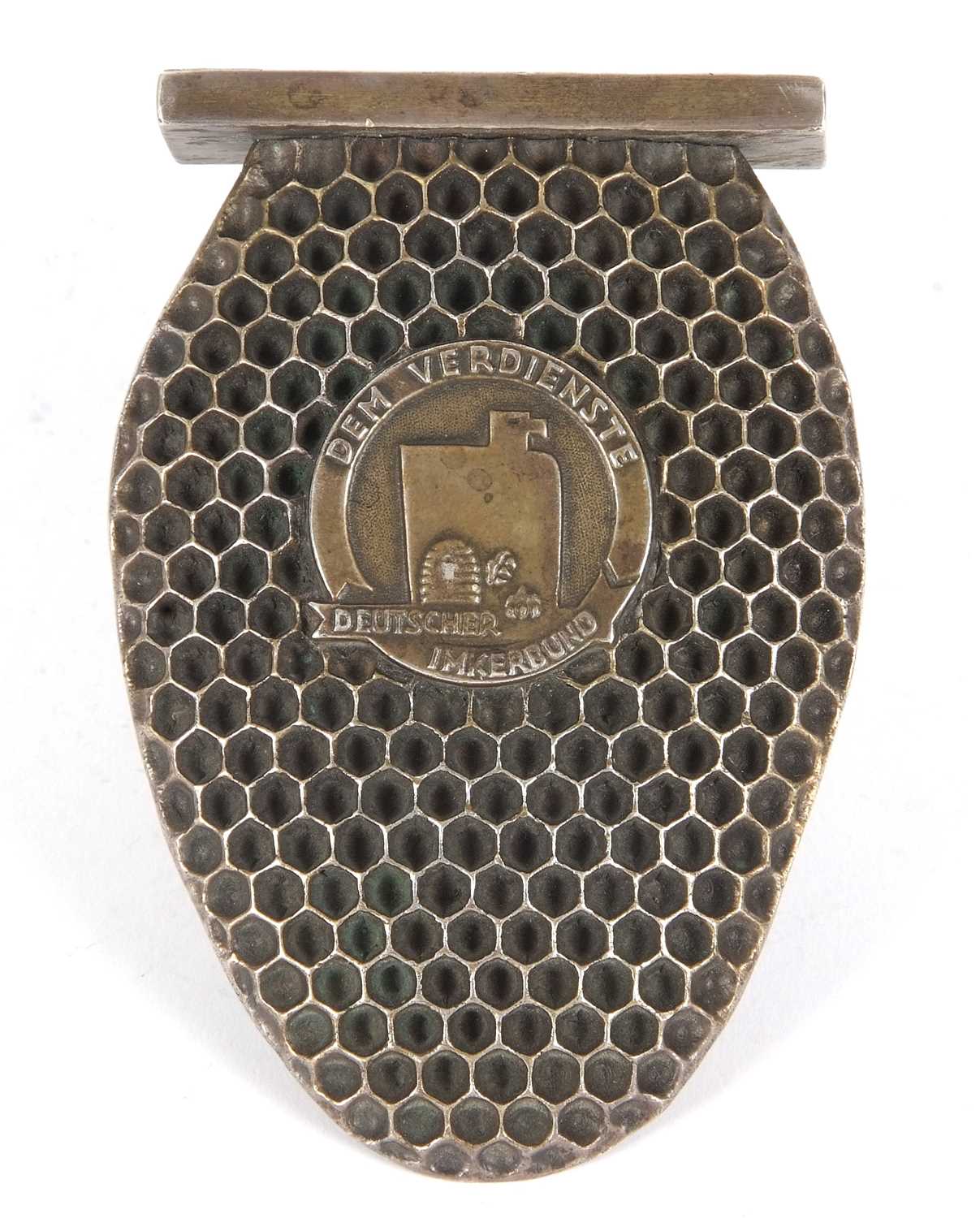 A German 800 stamped beekeeping award in the form of homeycomb, the centre applied with a plaque