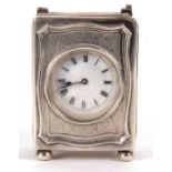 A George V silver cased boudoir carriage clock, the clock has a white enamel dial, black Roman