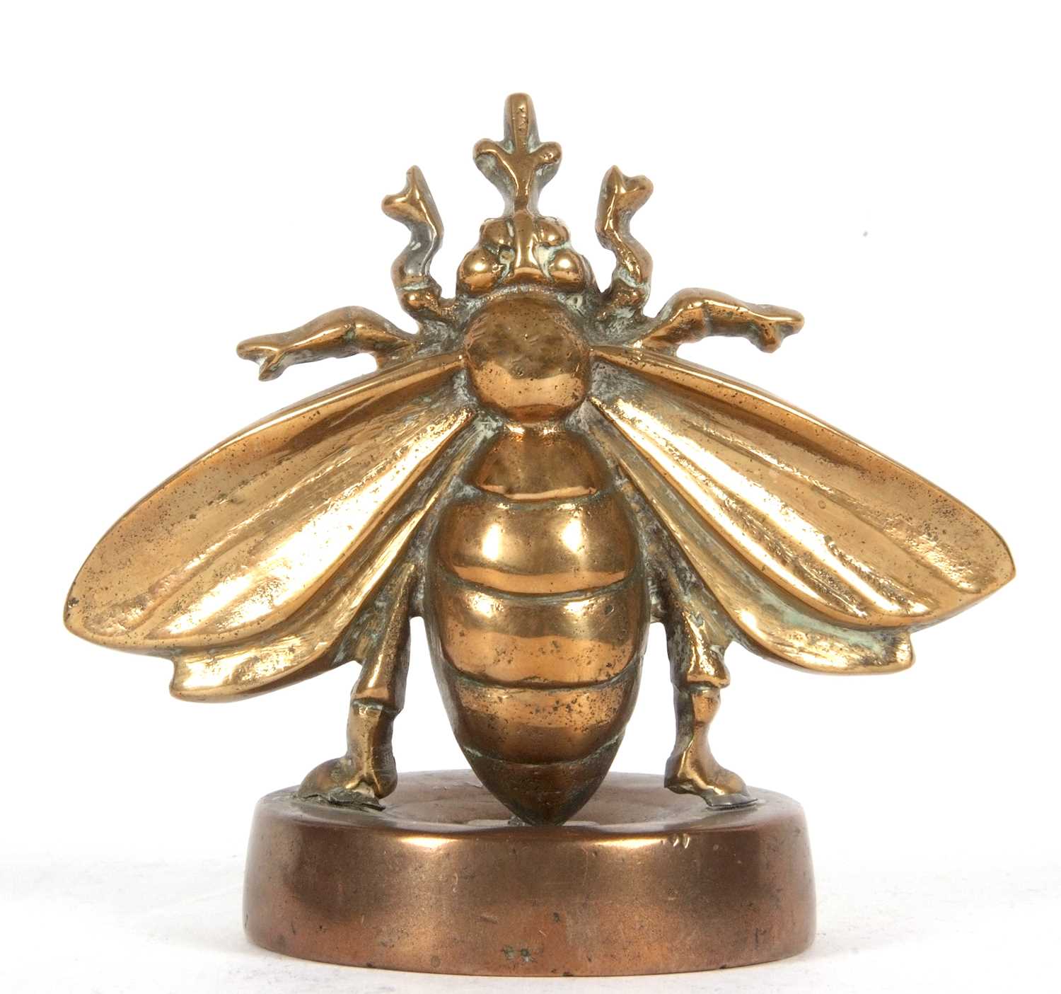 A large vintage bronze bee desk paperweight the base marked with letters and devices, the wingspan