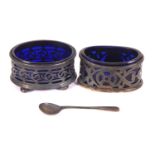 Two early 19th Century silver oval pierced salts with blue glass liners, hallmarked for Chester 1904