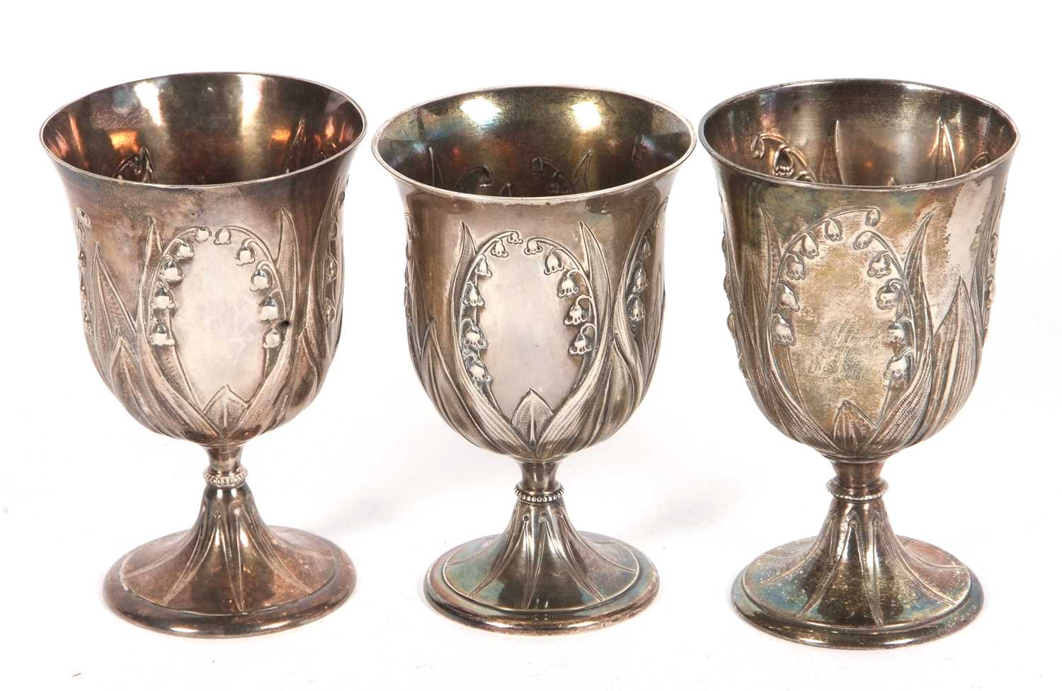 A group of three Victorian goblets each decorated with the Lily of the Valley pattern hallmarked for