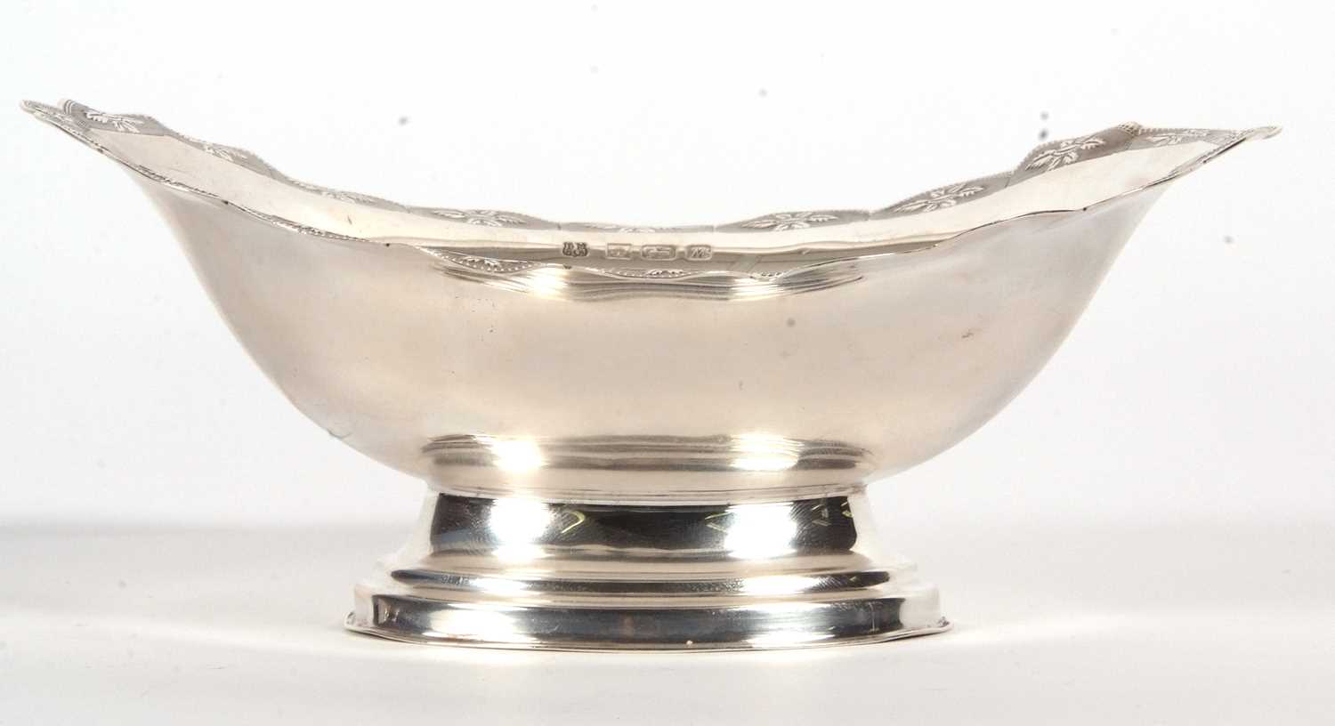 An Elizabeth II silver small pedestal dish of oval form having a shaped border, chased and - Image 2 of 4