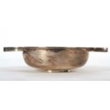 A George VI silver large quaich of plain design and typical form, having twin hollow handles and