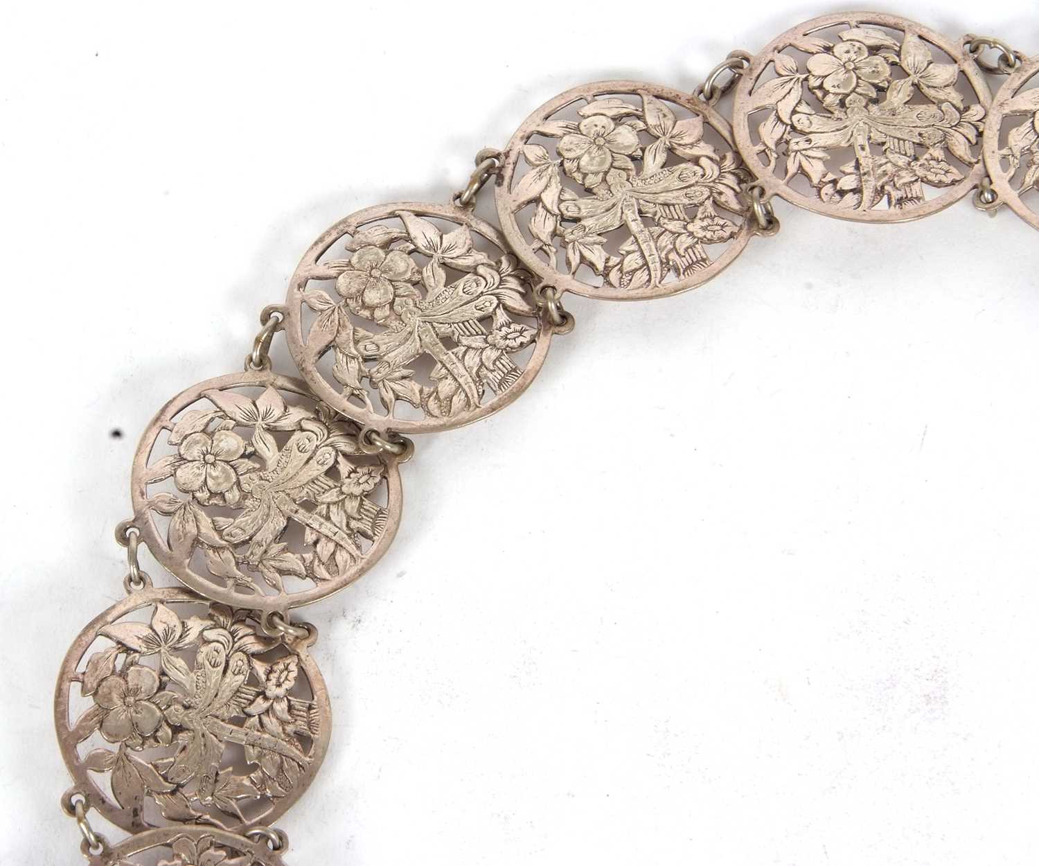 A vintage EPNS belt comprising sixteen circular pierced floral links to a square floral buckle, 68cm - Image 5 of 5
