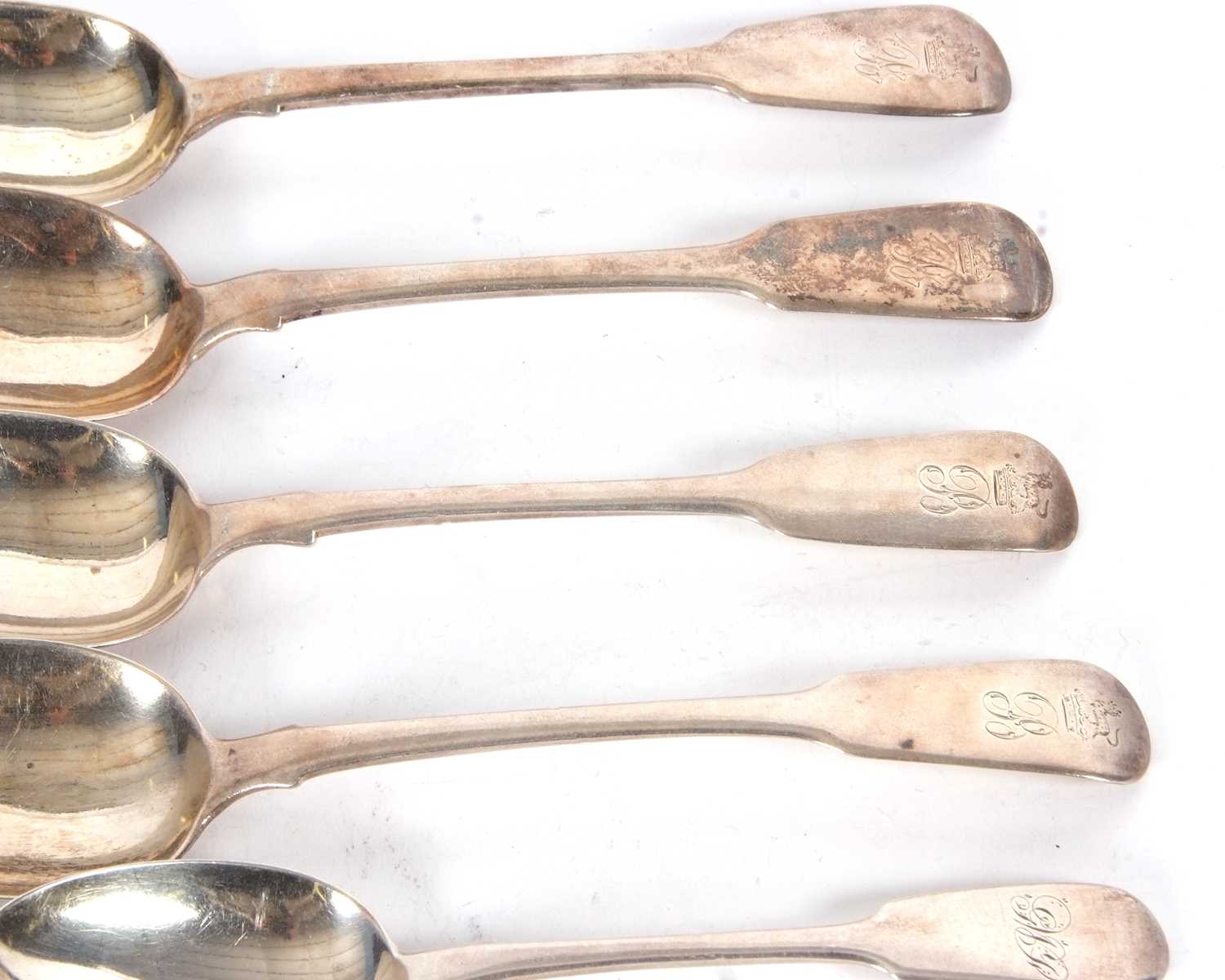 A group of four Georgian and one Victorian silver table spoon, engraved with crests and initials - Image 3 of 5