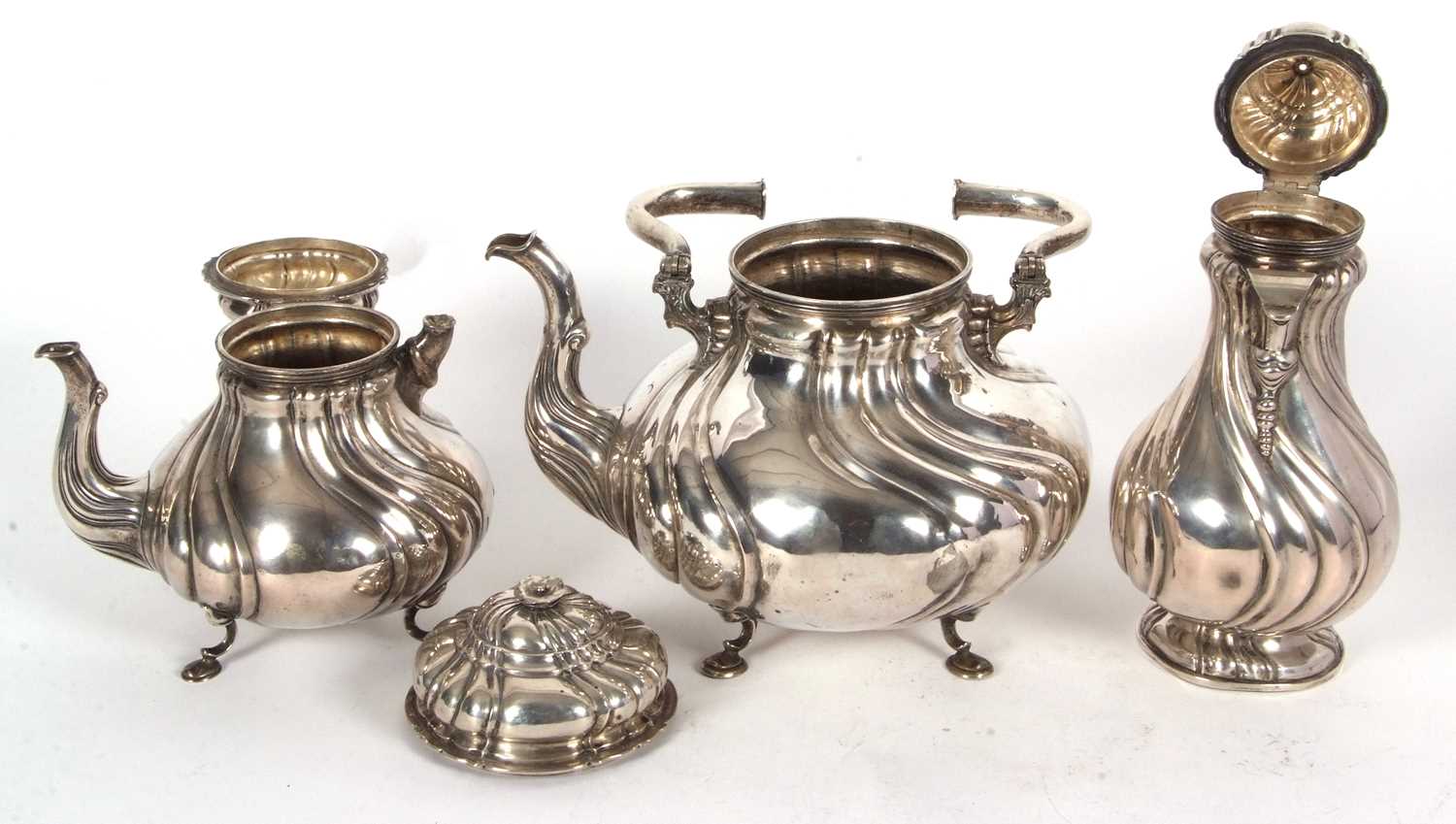 A 19th Century German white metal tea set comprising a large coffee pot, teapot, hot water kettle, - Image 6 of 9