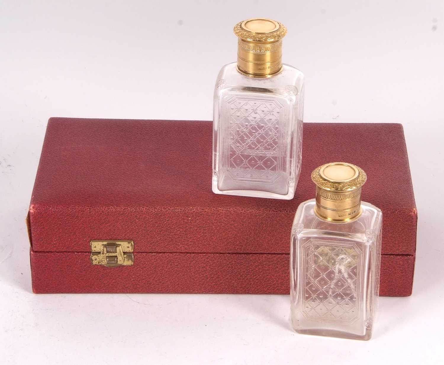 A cased pair of Asprey & Co cologne bottles, the glass etched bodies with gilt metal collars and - Image 3 of 3