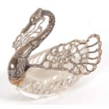 An import 925 marked and cut glass swan dish, the swan with pierced hinge folding wings, each