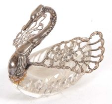 An import 925 marked and cut glass swan dish, the swan with pierced hinge folding wings, each