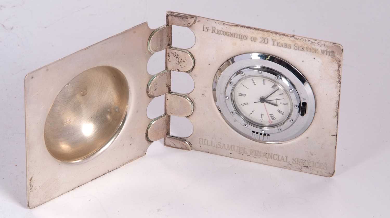 A silver cased quartz clock with presentation engraving, hallmarked on the inside of the case