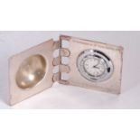 A silver cased quartz clock with presentation engraving, hallmarked on the inside of the case