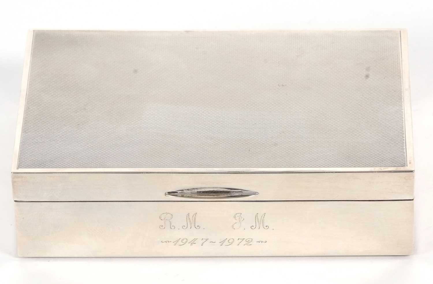 An Elizabeth II silver cigarette box of rectangular form, having an engine turned decorated lid with - Image 2 of 3