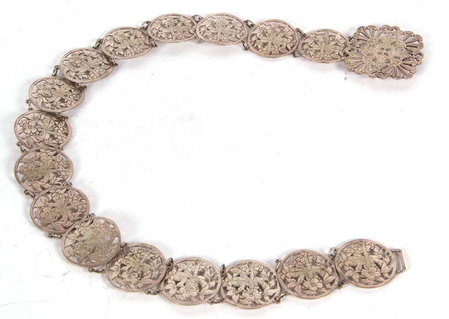 A vintage EPNS belt comprising sixteen circular pierced floral links to a square floral buckle, 68cm - Image 3 of 5
