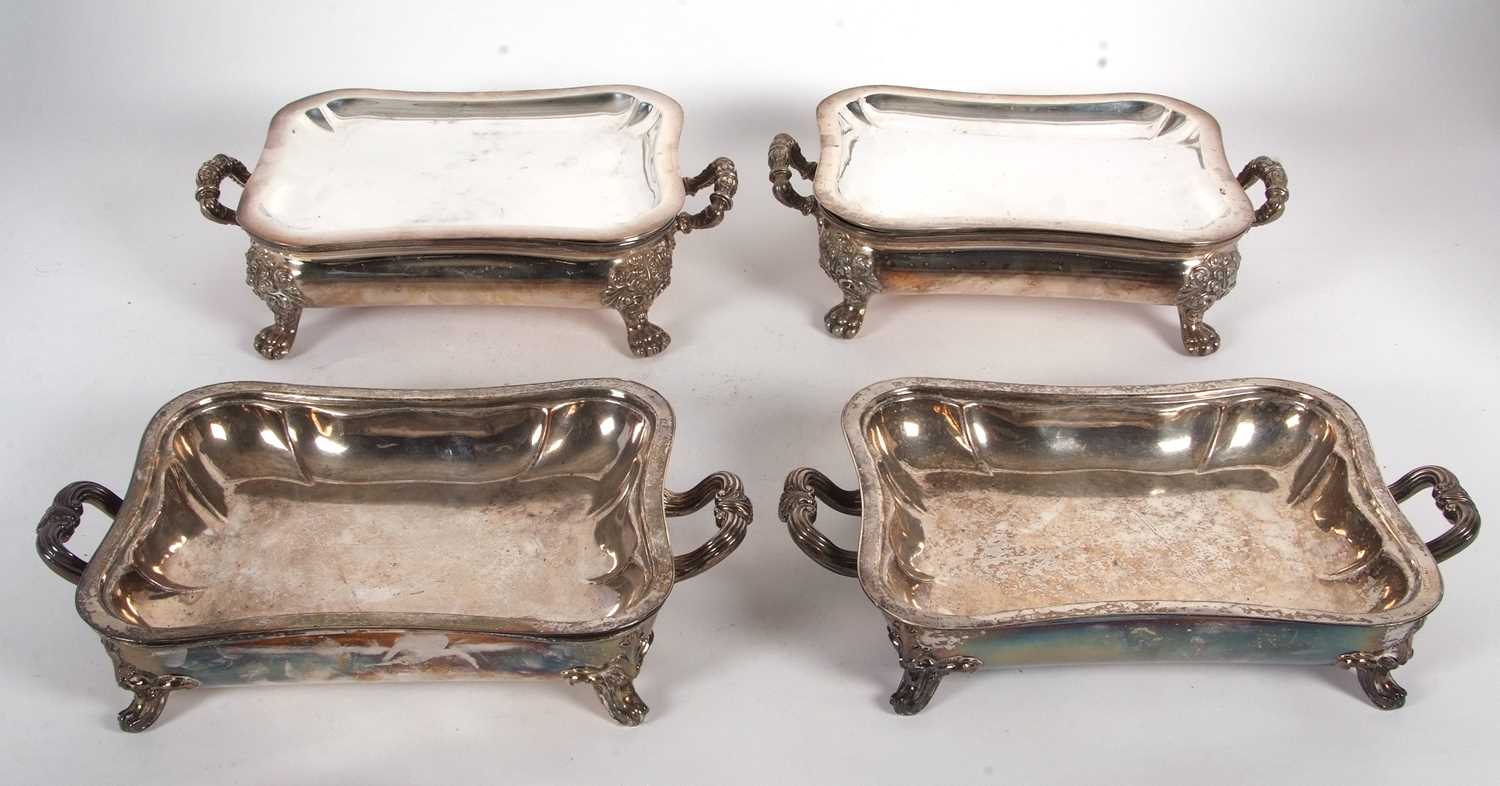 A pair of Old Sheffield plated chaffing/warming dishes of typical form with plain lift off trays,