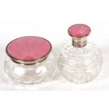 An Art Deco glass dressing table scent and powder bowl, each with pink enamel guilloche decoration
