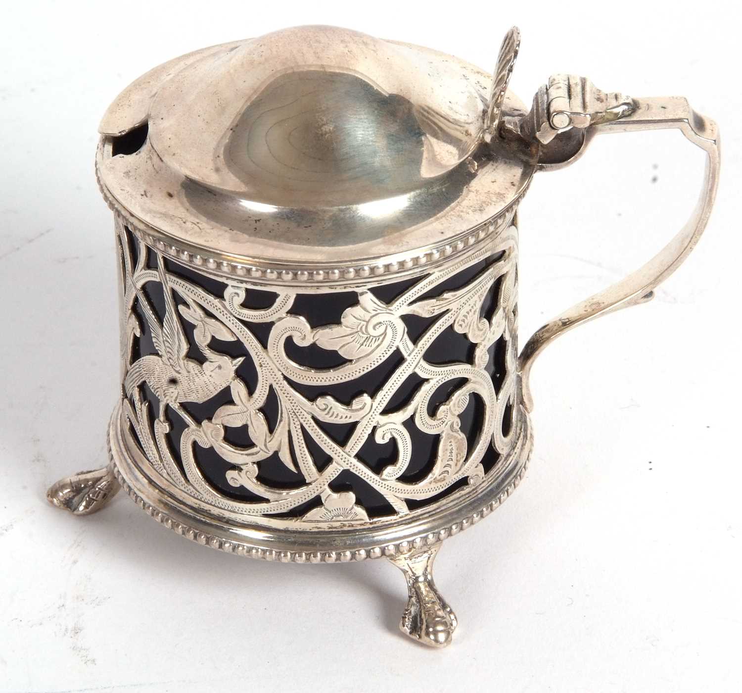 An Edwardian silver pierced drum mustard, the hinged lid with a slight domed plain design, shell - Image 2 of 4