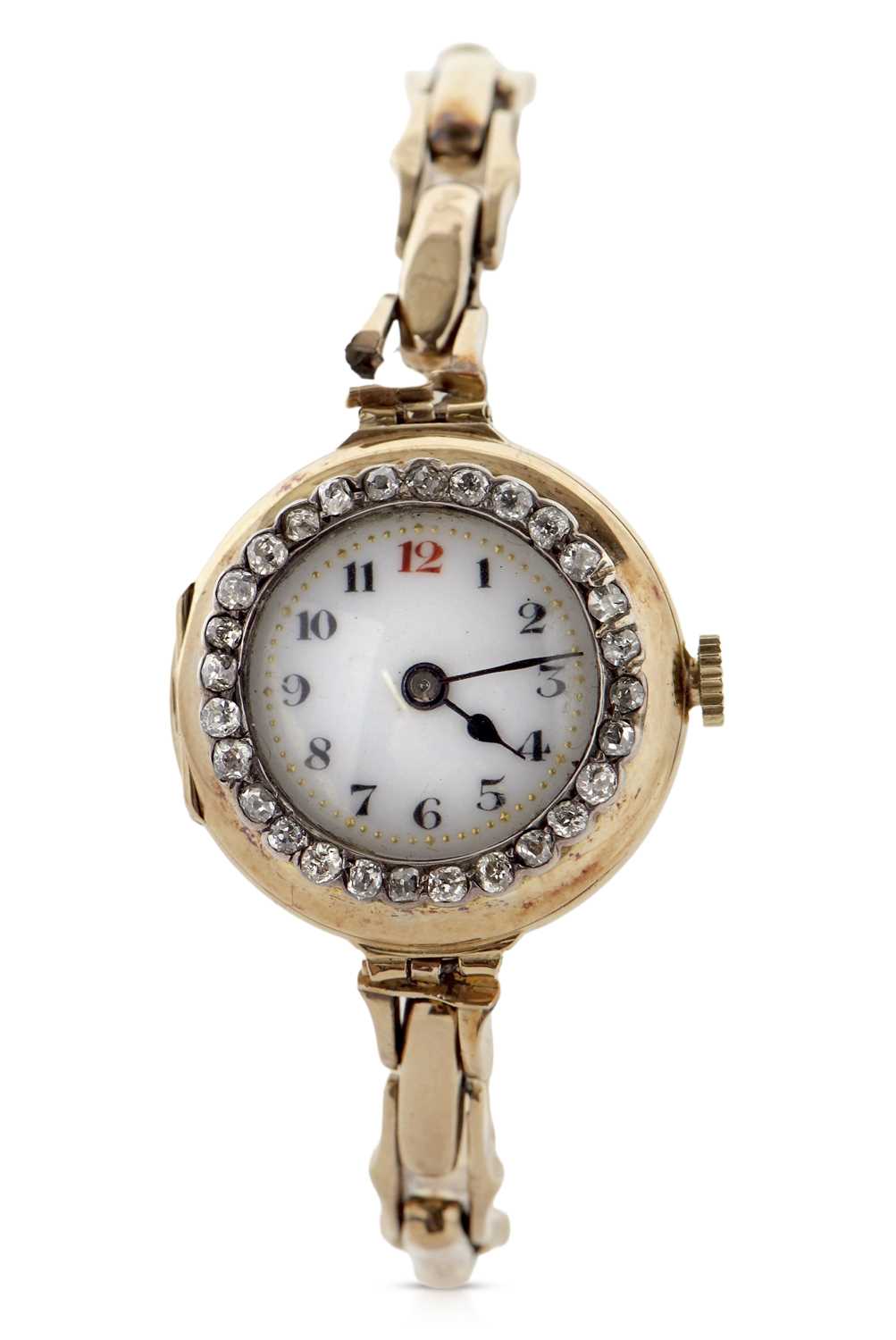 An 18ct gold cased ladies wristwatch with a diamond surrounded bezel and yellow metal expanding