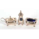 An Elizabeth II silver condiment set comprising a hinged lidded mustard and plastic liner, open salt