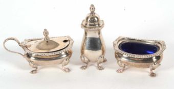 An Elizabeth II silver condiment set comprising a hinged lidded mustard and plastic liner, open salt
