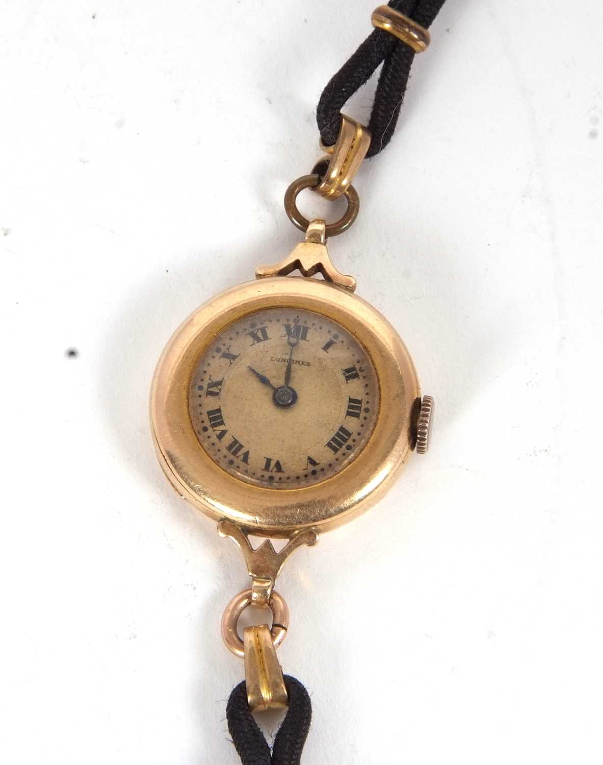 A vintage Longines yellow metal wristwatch, the inside of the case back is stamped 14k, it has a