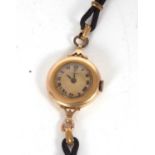 A vintage Longines yellow metal wristwatch, the inside of the case back is stamped 14k, it has a