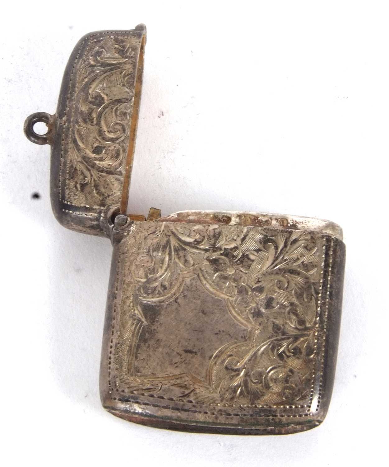 An Edwardian silver vester, chased and engraved all over around a plain shield cartouche, Birmingham - Image 2 of 2