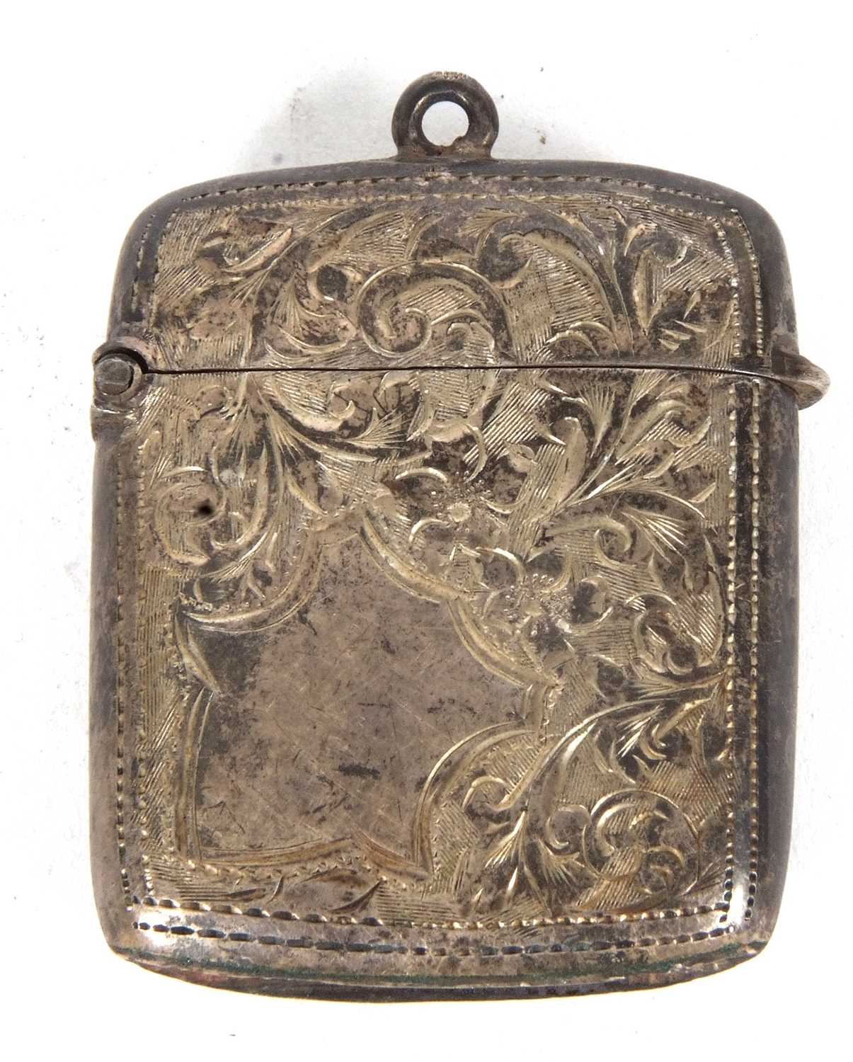 An Edwardian silver vester, chased and engraved all over around a plain shield cartouche, Birmingham