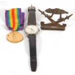 Mixed Lot: A wristwatch, a medal and an ornament, the watch is a manually crown wound Roma, it has a