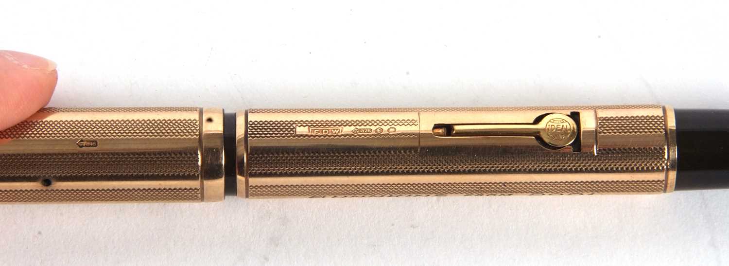 A Watermans Ideal 9ct gold cased fountain pen, engine turned decorated barrel and screw off cap, - Image 5 of 7