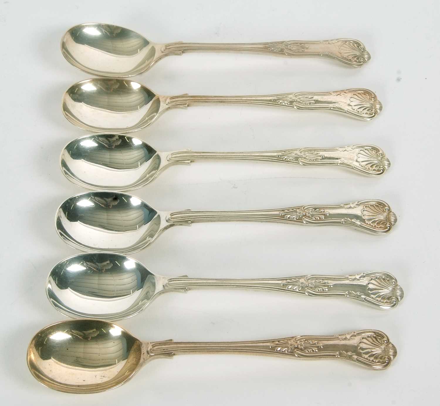 Six Elizabeth II silver Kings pattern dessert spoons, London 1961, makers mark for C J Vander Ltd,