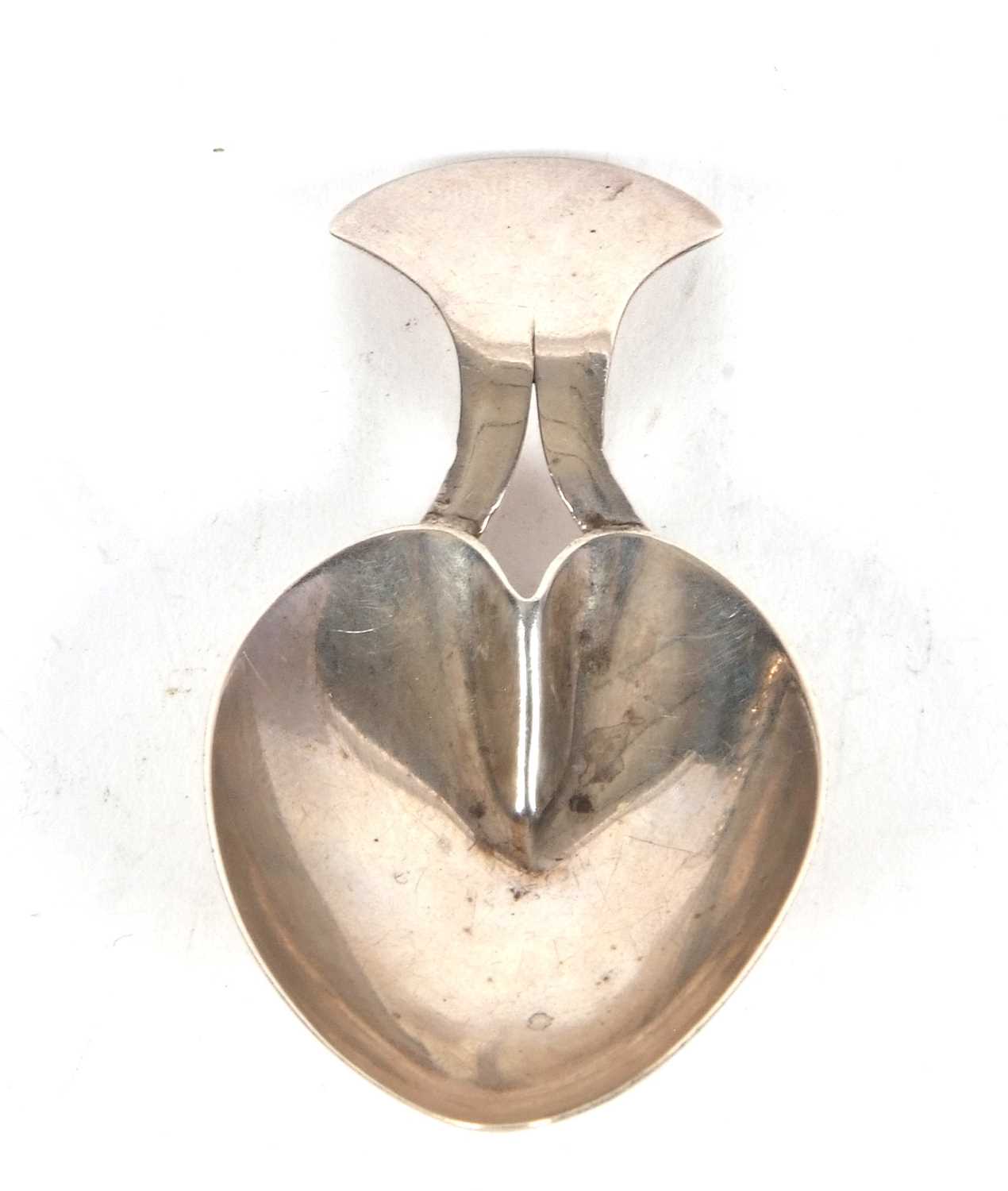 A George III silver caddy spoon of heart shape, hallmarked London 1805, makers mark for Josiah