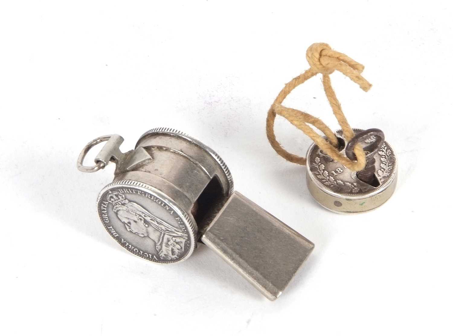 Mixed Lot: Vintage small whistle, the barrel shaped chamber with two Victorian sixpence coins