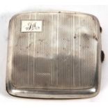 A George V silver cigarette case of square form, engine turn decorated and initialled (a/f),