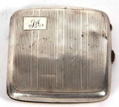 A George V silver cigarette case of square form, engine turn decorated and initialled (a/f),