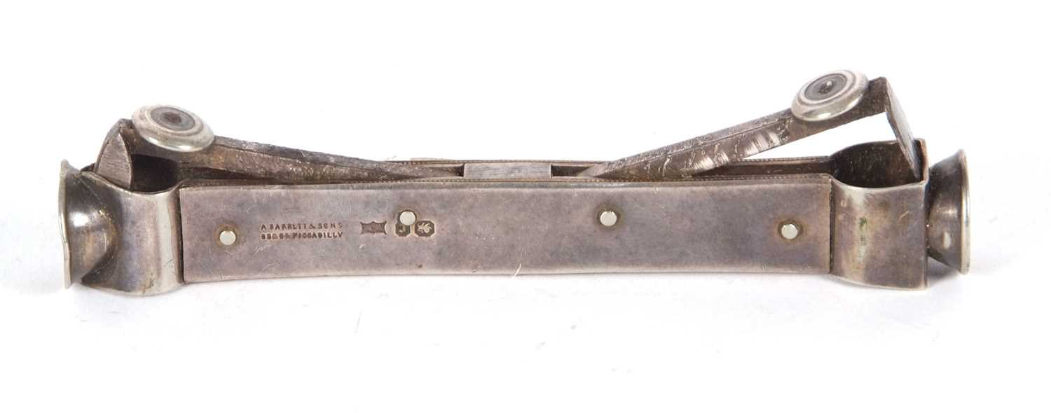 A late Victorian silver cased double ended cigar cutter with steel arms and blades, hallmarked for