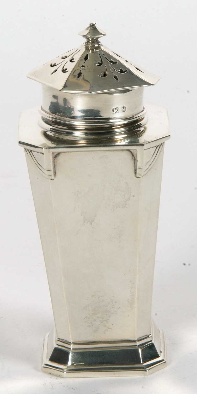 An Art Deco silver caster of plain tapering octagonal form with angular designed shoulders, pull off