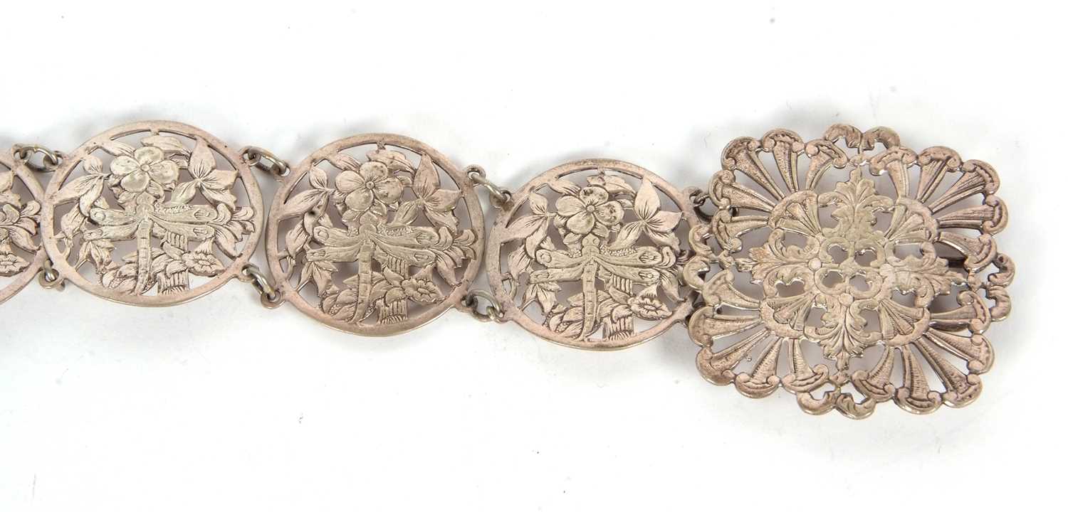 A vintage EPNS belt comprising sixteen circular pierced floral links to a square floral buckle, 68cm - Image 4 of 5