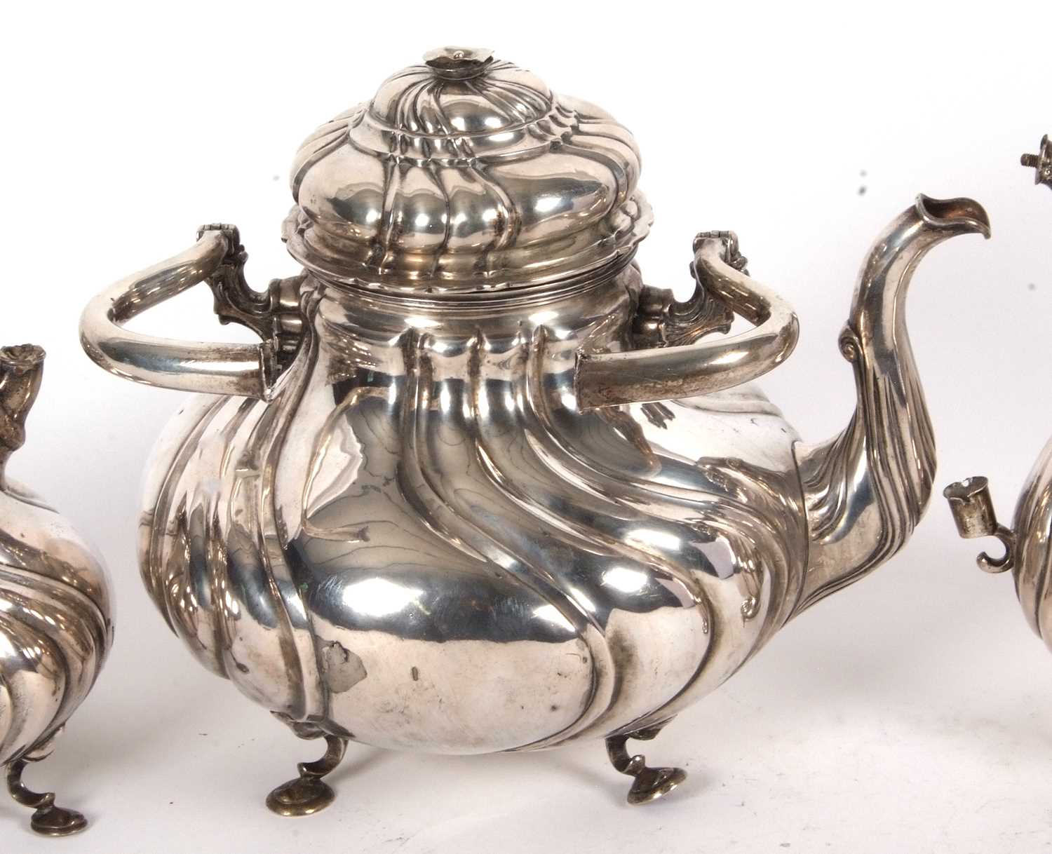A 19th Century German white metal tea set comprising a large coffee pot, teapot, hot water kettle, - Image 4 of 9