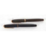 A vintage Parker duo-fold 14k N brown fountain, Reg No 784404, 13cm long together with a black