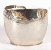 A late Victorian silver sugar basket of plain oval form having reeded borders and swing handle,
