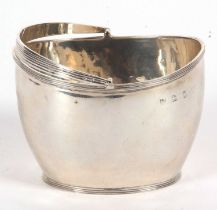 A late Victorian silver sugar basket of plain oval form having reeded borders and swing handle,