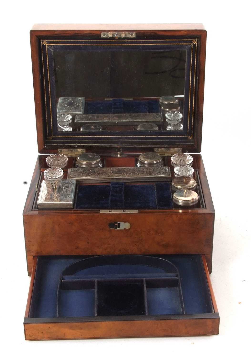 A 19th Century walnut vanity box, ebony banded with insert mother of pearl plaque, the lined