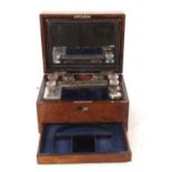 A 19th Century walnut vanity box, ebony banded with insert mother of pearl plaque, the lined
