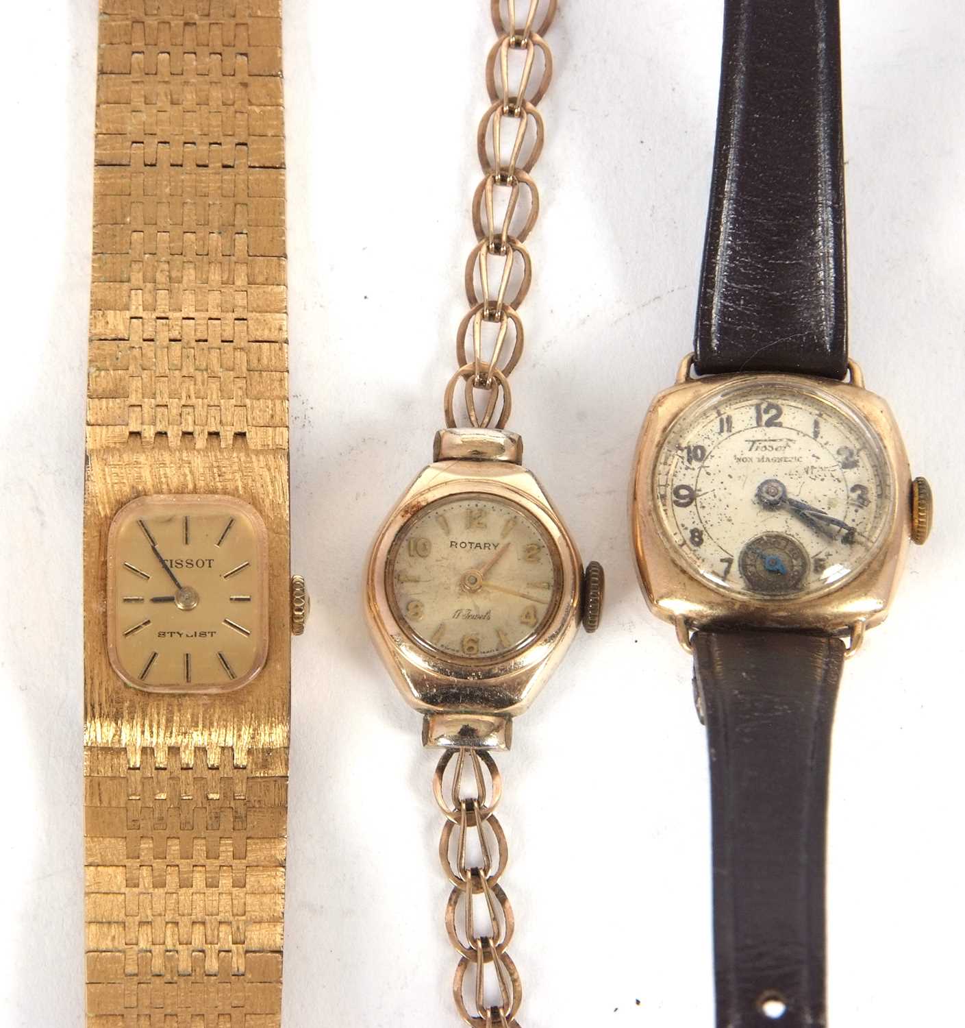 A mixed lot of ladies wristwatches to include a 9ct gold Tissot, a metal Tissot and a Rotary with