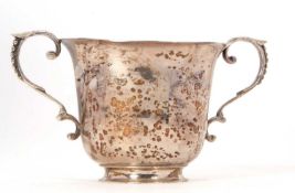 An Edwardian silver twin handles poringer or loving cup, of plain trophy form with two beeded capped