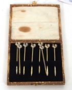 A set of eight George V silver gilt cocktail sticks each with cockerel finials, hallmarked for