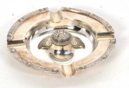 A George VI silver ashtray of circular form having a Celtic design dome centre and border, 12cm