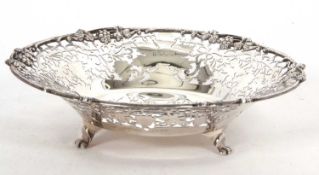 George VI silver fruit dish of shallow circular form, the pierced vine and scroll sides with applied