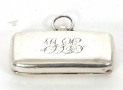 A hallmarked silver double sovereign holder of plain polished rectangular form, initialled to the