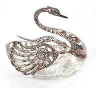 A large cut glass and white metal swan dish, the body with cut glass (cracks), the articulated